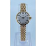 9CT LADIES ROTARY WRISTWATCH, the dial having Arabic numerals, with integrated 9ct gold brickwork