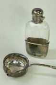 GEORGE V SILVER FLASK & GEORGIAN TODDY LADLE, glass flask with faceted sides and hinged screw