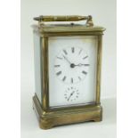 GILT BRASS ALARM CARRIAGE CLOCK, white enamel roman dial, moon hands, alarm sub dial, platform