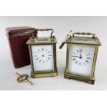 TWO GILT BRASS CARRIAGE CLOCKS, both with white enamel roman dials, one French the other with