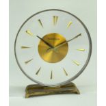 JAEGER LECOULTRE 'MYSTERY' CLOCK, circular perspex dial, baton numerals, gilt base, 15cm h Comments;