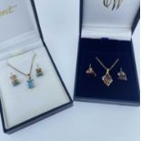 TWO 9CT GOLD SUITES OF JEWELLERY comprising blue topaz pendant on chain with pair of matching