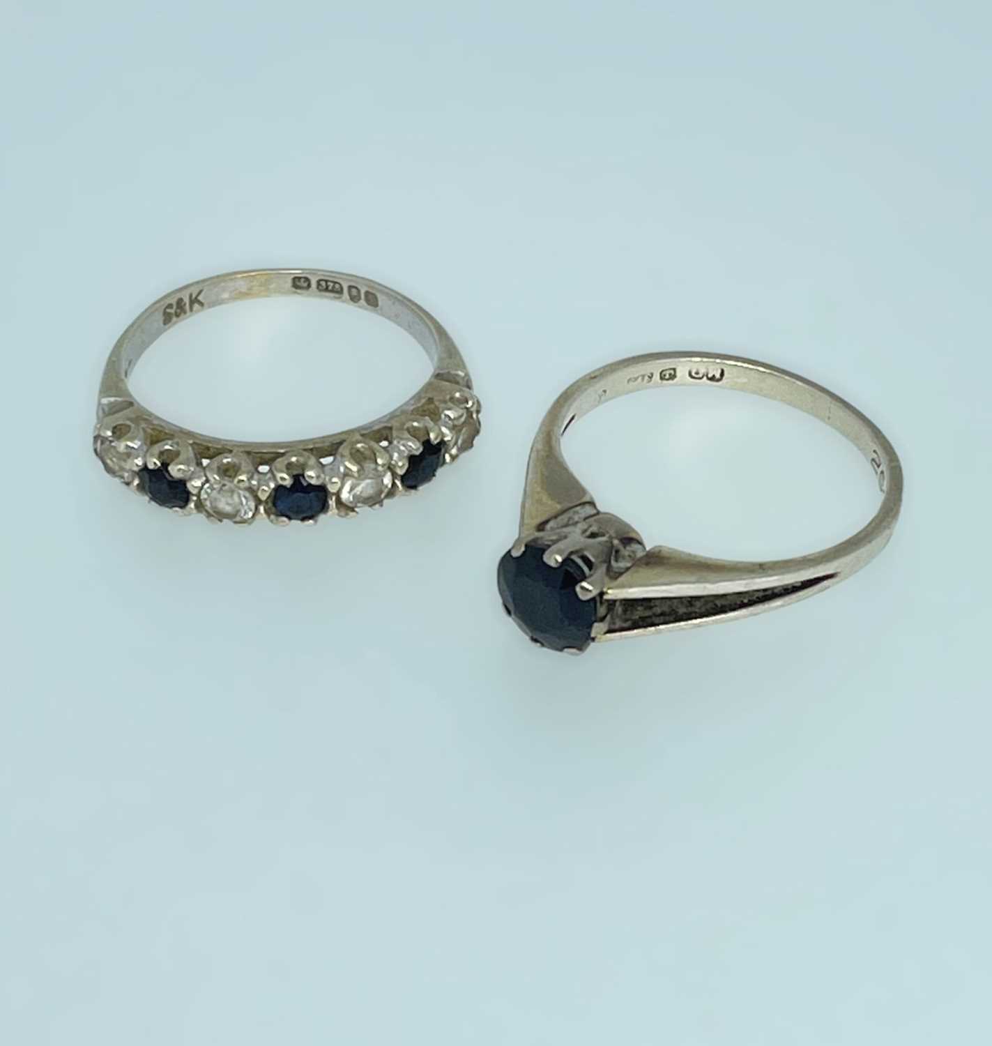 TWO 9CT WHITE GOLD RINGS one set with single sapphire and the other set with sapphires and diamond