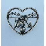 GEORG JENSEN SILVER BROOCH, modelled as a pair of dolphins within a heart shaped border, No 312,