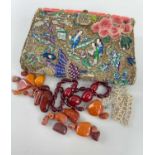 VINTAGE LADIES 'BRITISH MADE' ORIENTAL INSPIRED CLUTCH BAG containing assorted beads including