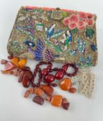 VINTAGE LADIES 'BRITISH MADE' ORIENTAL INSPIRED CLUTCH BAG containing assorted beads including