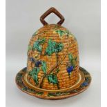 MAJOLICA CHEESE BELL & BASE, modelled as a beehive with fruiting vines, stamped 'MINTON' to the