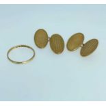 9CT GOLD JEWELLERY comprising pair of 9ct gold engine turned oval cufflinks and a 9ct gold band, 5.