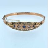 9CT GOLD BANGLE set with three sapphires and two diamonds, 10.0gms, in Crouch of Swansea box