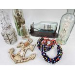 A GROUP OF MARITIME SOUVENIRS comprising four models 'in bottles' including one galleon and