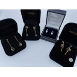 FOUR BOXED PAIRS OF GOLD EARRINGS comprising a piar of 18ct white gold diamond earrings and three