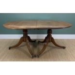 GEORGE III-STYLE MAHOGANY D-END TWIN PEDESTAL DINING TABLE, reeded edge above ring turned columns,