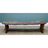 PROVINCIAL ELM PLANK LONG BENCH, the roughly hewn seat with natural edge raised on trestle