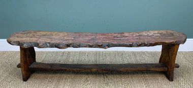 PROVINCIAL ELM PLANK LONG BENCH, the roughly hewn seat with natural edge raised on trestle