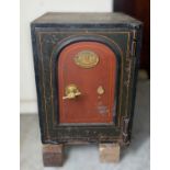SAMUEL WITHERS & CO. CAST IRON SAFE, with fist handle, trademark plaque to the painted door,