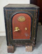 SAMUEL WITHERS & CO. CAST IRON SAFE, with fist handle, trademark plaque to the painted door,