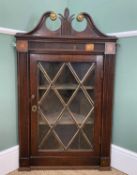 GEORGE III OAK HANGING CORNER CABINET, swan neck pediment with brass mounts and centred with leaf