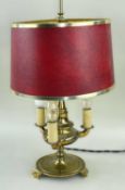 GILT BRASS BUILLOTTE TABLE LAMP, with adjustable red shade, three lights, circular base raised on