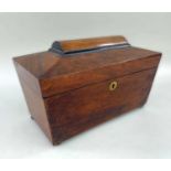 19TH CENTURY MAHOGANY TEA CADDY, of sarcophagus form, with part ebonised top, fitted interior, 29.