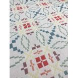 WELSH WOOLLEN REVERSIBLE TAPESTRY BLANKET with fringes to both ends, repeating geometric patterns in