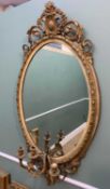 VICTORIAN GILTWOOD & GESSO OVAL GIRANDOLE MIRROR, acanthus and foliate scrolled crest above oval