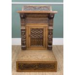 GOTHIC-STYLE CARVED OAK PRIE-DIEU DESK, caryatid uprights with lion mask capitals, carved arcaded