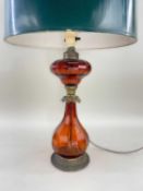 19TH CENTURY GILT METAL MOUNTED AMBER GLASS OIL LAMP, faceted baluster body and oil receptacle (