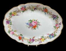 NANTGARW PORCELAIN OVAL DISH circa 1818-1820, of lobed form, painted with twelve outer posies