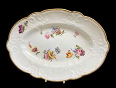 NANTGARW PORCELAIN OVAL DISH circa 1815-1817, of lobed form, typically moulded with c-scrolls,