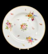 NANTGARW PORCELAIN PLATE circa 1818-1820, decorated with four colourful posies and a scattering of