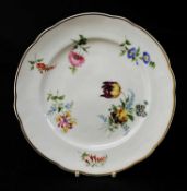 NANTGARW PORCELAIN PLATE circa 1818-1820, having a wavy border, painted with six scattered flower
