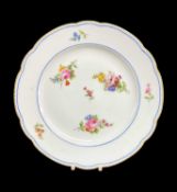 NANTGARW PORCELAIN PLATE circa 1817-1820, lobed form, unmoulded, decorated with seven scattered