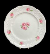 NANTGARW PORCELAIN PLATE circa 1818-1820, typically moulded with c-scrolls, flowers and tied
