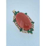 14CT GOLD CORAL, DIAMOND & EMERALD PENDANT, the large central cabochon coral (28 x 17mms) within