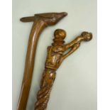 TWO FOLK ART WALKING STICKS, comprising one with twisted snake, heart, anvil, etc carved stem (