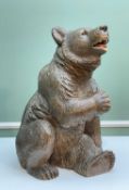 SWISS 'BLACK FOREST' LINDENWOOD BEAR, seated with open mouth revealing painted details, painted