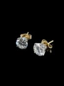 PAIR OF 14KT GOLD DIAMOND STUD EARRINGS, the two round brilliant cut stones measuring 2.0cts overall