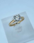 14K YELLOW GOLD DIAMOND SOLITAIRE RING, the single round brilliant cut stone measuring 1.5cts