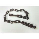 WELSH OR NORTH COUNTRY CARVED CHAIN LOVE TOKEN, with caged ball terminal above 10 links and pipe