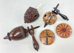 FIVE VARIOUS TREEN SPINNING TOPS, including one parquetry humming top with handle, rosewood