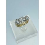 9CT GOLD THREE STONE DIAMOND RING, the three round brilliant cut stones measuring 2.0cts overall