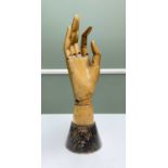 CARVED & JOINTED FRUITWOOD HAND MANNEQUIN, on tapering circular base, 30cms hProvenance:'The St John