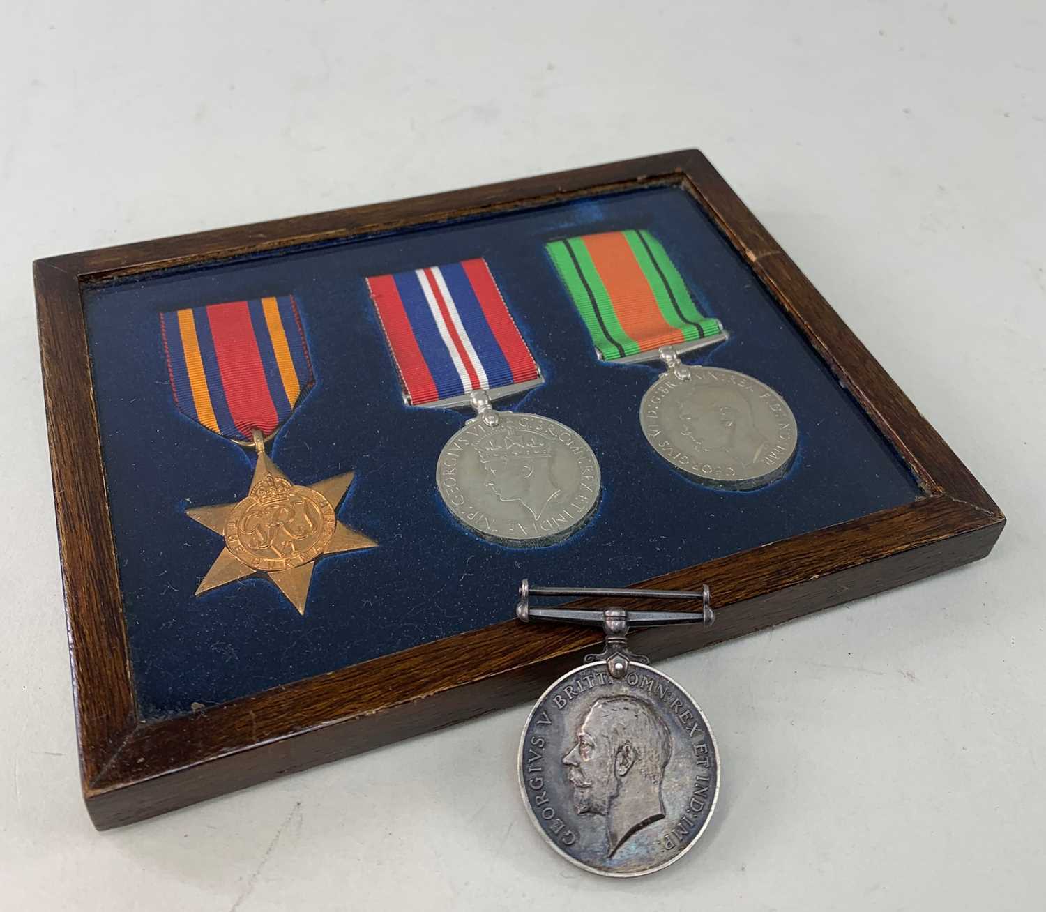 FRAMED SET OF THREE WW2 MEDALS, including The Burma Star, defence and war...