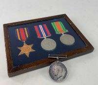 FRAMED SET OF THREE WW2 MEDALS, including The Burma Star, defence and war medals with ribbons,