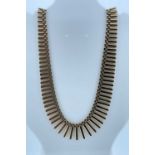 YELLOW GOLD FRINGE NECKLACE, of graduated tubular design, 40cms long, 31.5cms Provenance: private