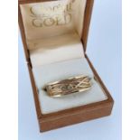 CLOGAU 9CT GOLD SCARF RING, set with three diamond chips, 10.1gms Provenance: Private collection
