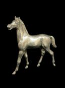 WHITE METAL MODEL OF A STANDING HORSE, 10cms tall, 120g