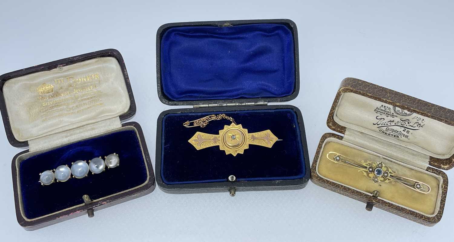 THREE VARIOUS BOXED BAR BROOCHES comprising 9ct gold sapphire and seed pearl brooch in Butt & Co