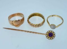 ASSORTED JEWELLERY comprising two yellow metal rings, 9ct gold cabochon opal ring, and a 15ct gold