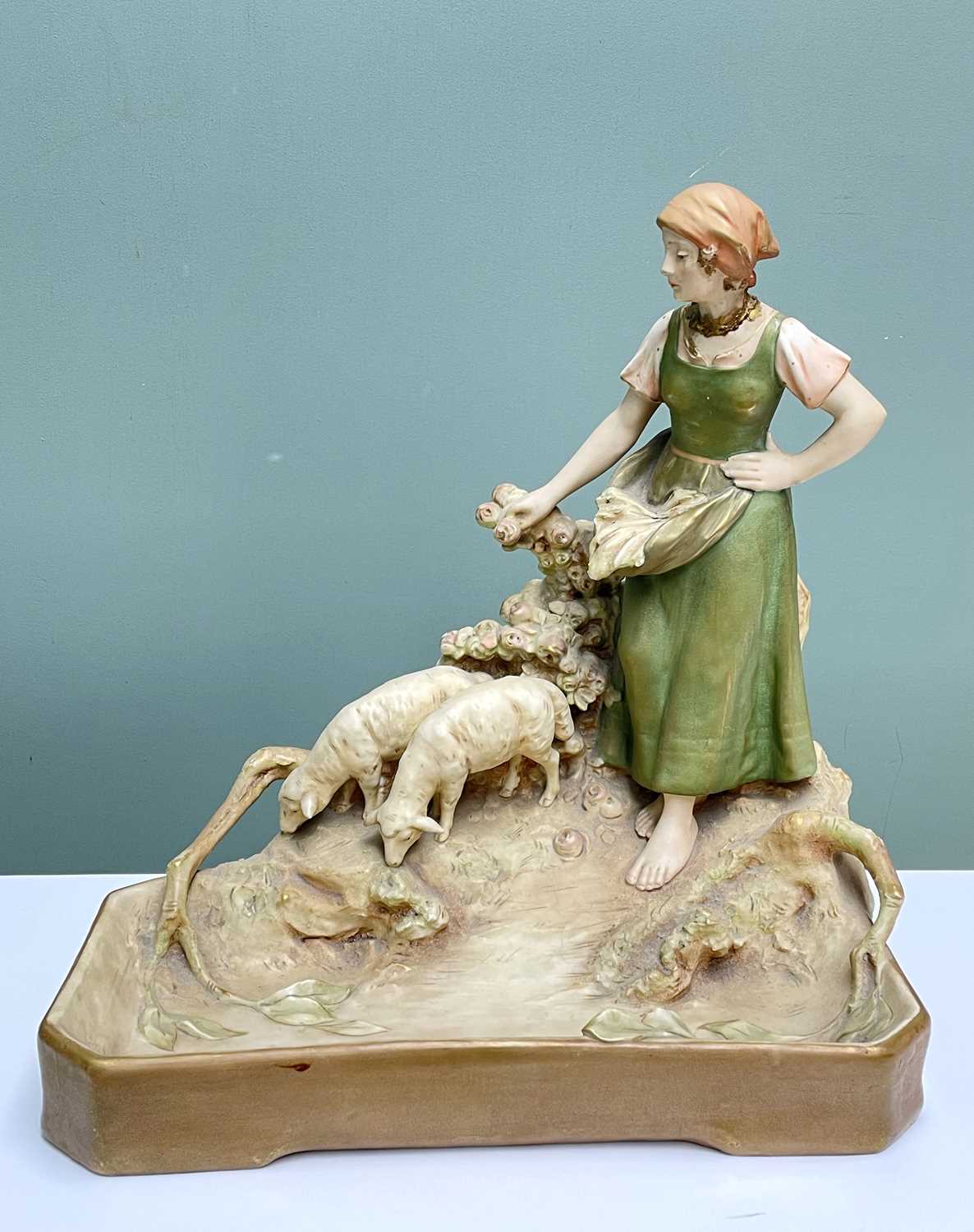 ROYAL DUX PORCELAIN FIGURE APRON WEARING SHEPHERDESS WITH TWO WATERING SHEEP, maker's mark to